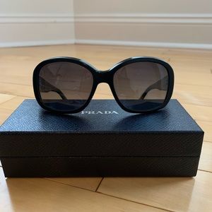 Prada sunglasses, black frame with gray lenses.  Style 1AB-5W1
